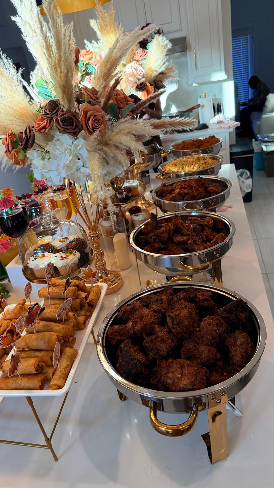 Luxury home buffet with florals and hot chafing dishes